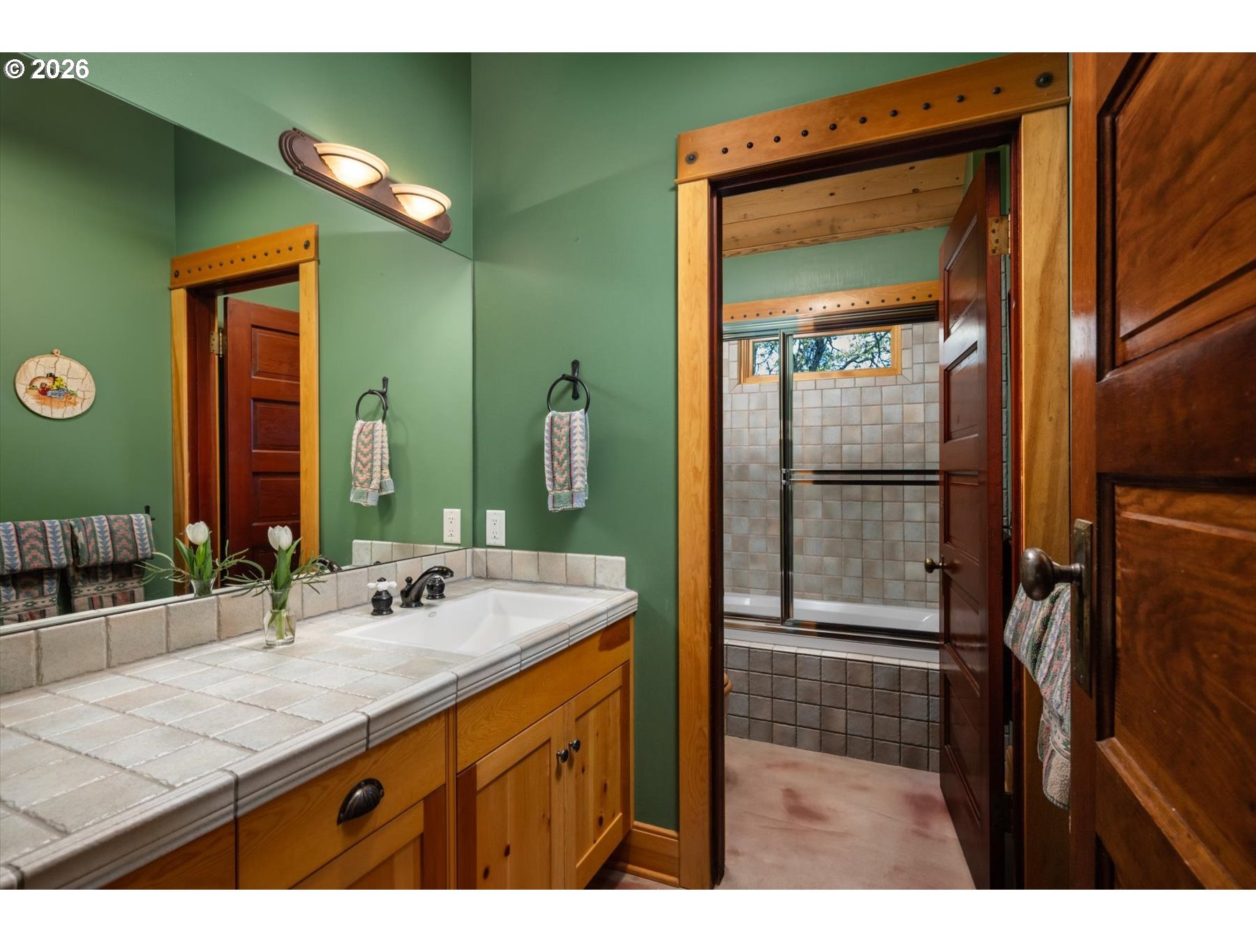 1945 Cynthia Way Mosier, OR 97040 - Photo 27 of 48 a bathroom with a sink a mirror and a shower