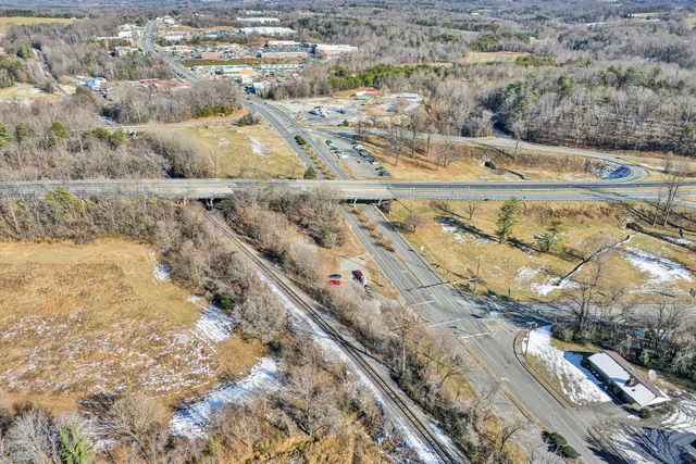 a view of a swimming pool with a yard