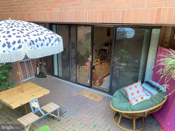 a backyard with a fountain table and chairs