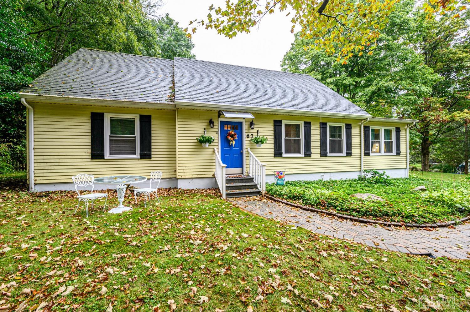 front view of a house with a yard
