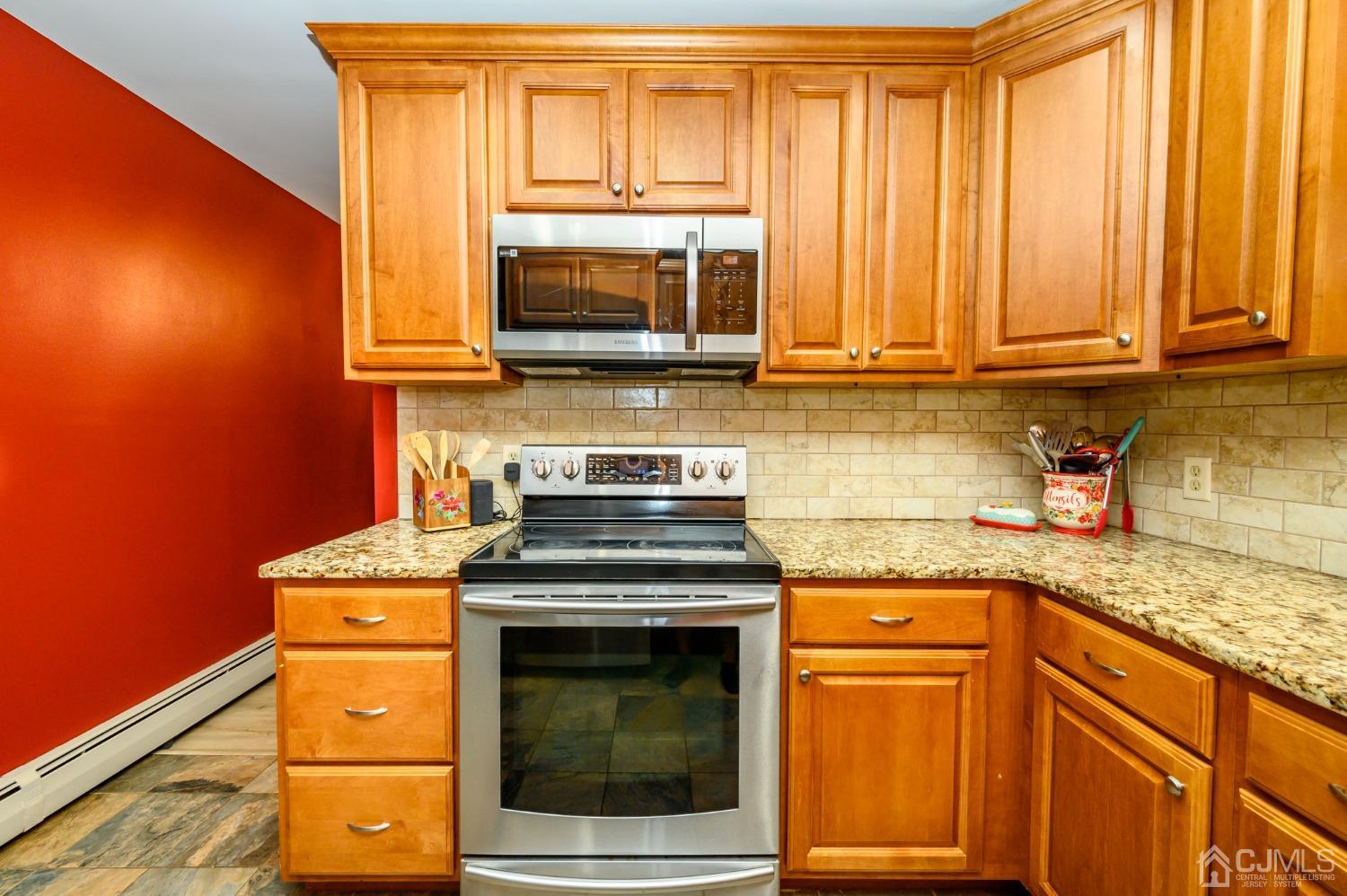 67 Hollow Road Glen Gardner, NJ 08826 - Photo 15 of 45 a kitchen with granite countertop cabinets stainless steel appliances and a sink