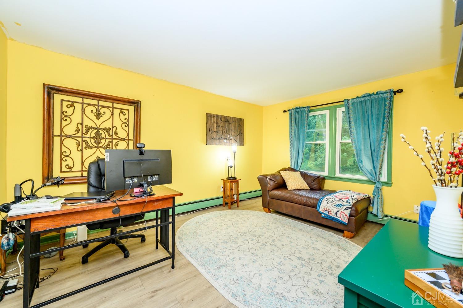 67 Hollow Road Glen Gardner, NJ 08826 - Photo 18 of 45 a living room with furniture and a window