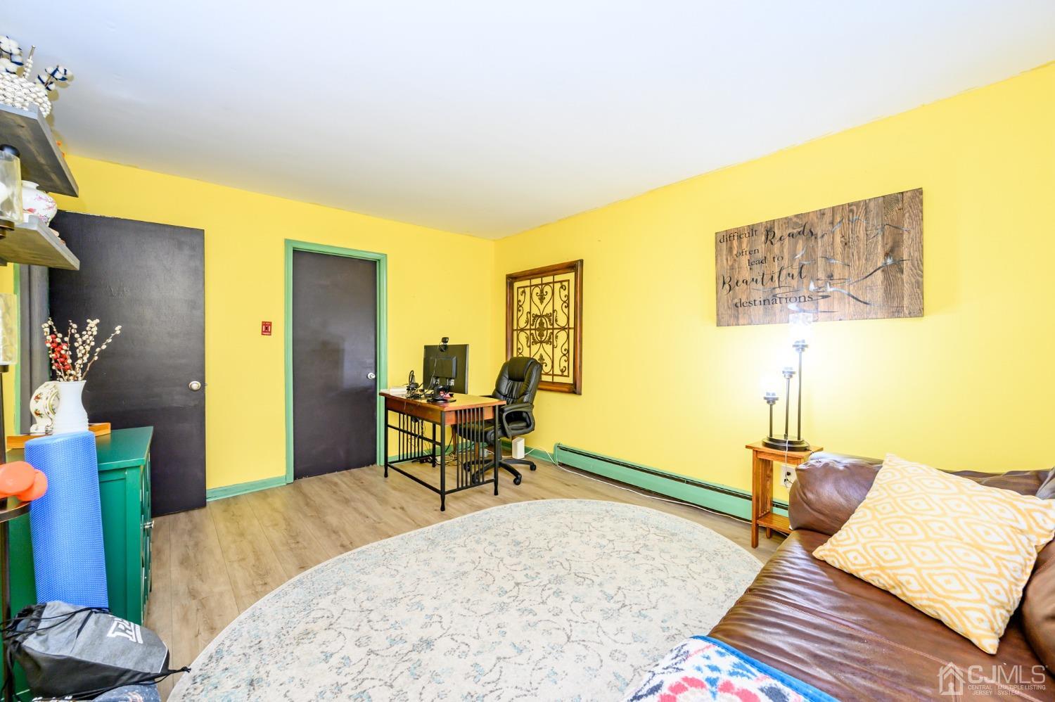67 Hollow Road Glen Gardner, NJ 08826 - Photo 19 of 45 a bedroom with furniture and a wooden floor
