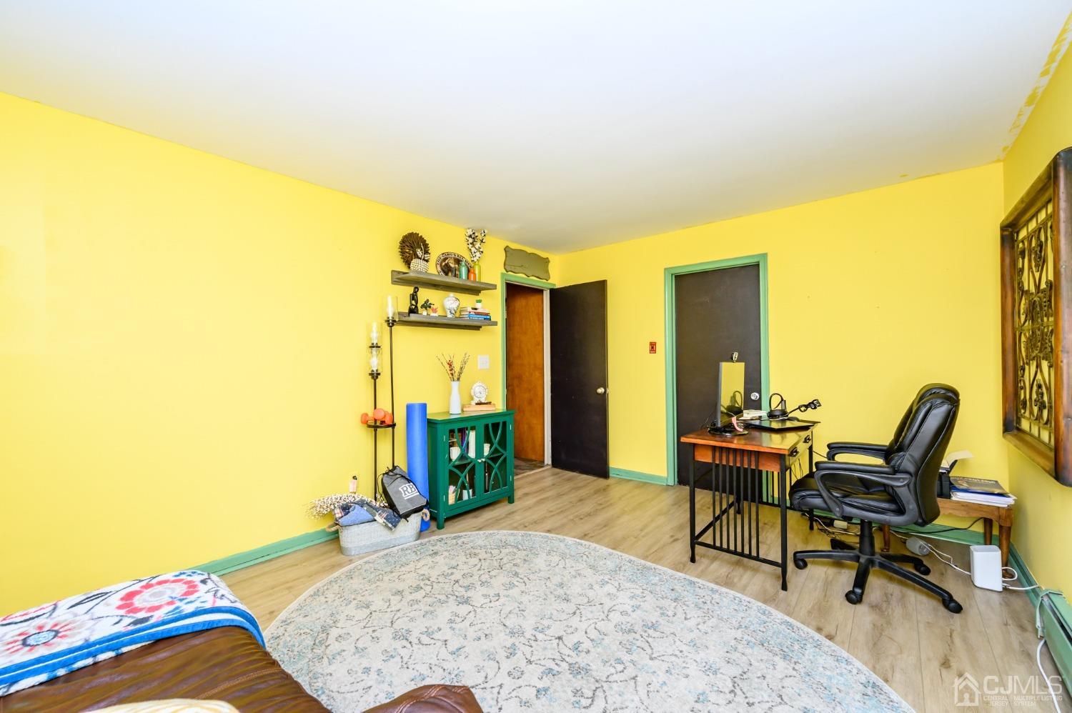 67 Hollow Road Glen Gardner, NJ 08826 - Photo 20 of 45 a bedroom with a bed and large windows