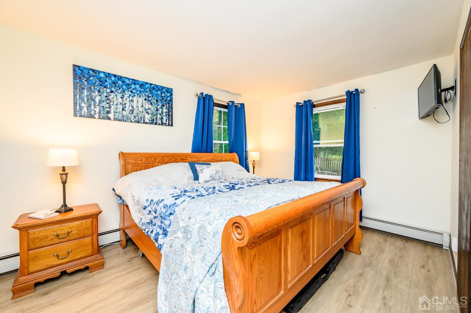 67 Hollow Road Glen Gardner, NJ 08826 - Photo 22 of 45 a bed room with a bed and a night stand