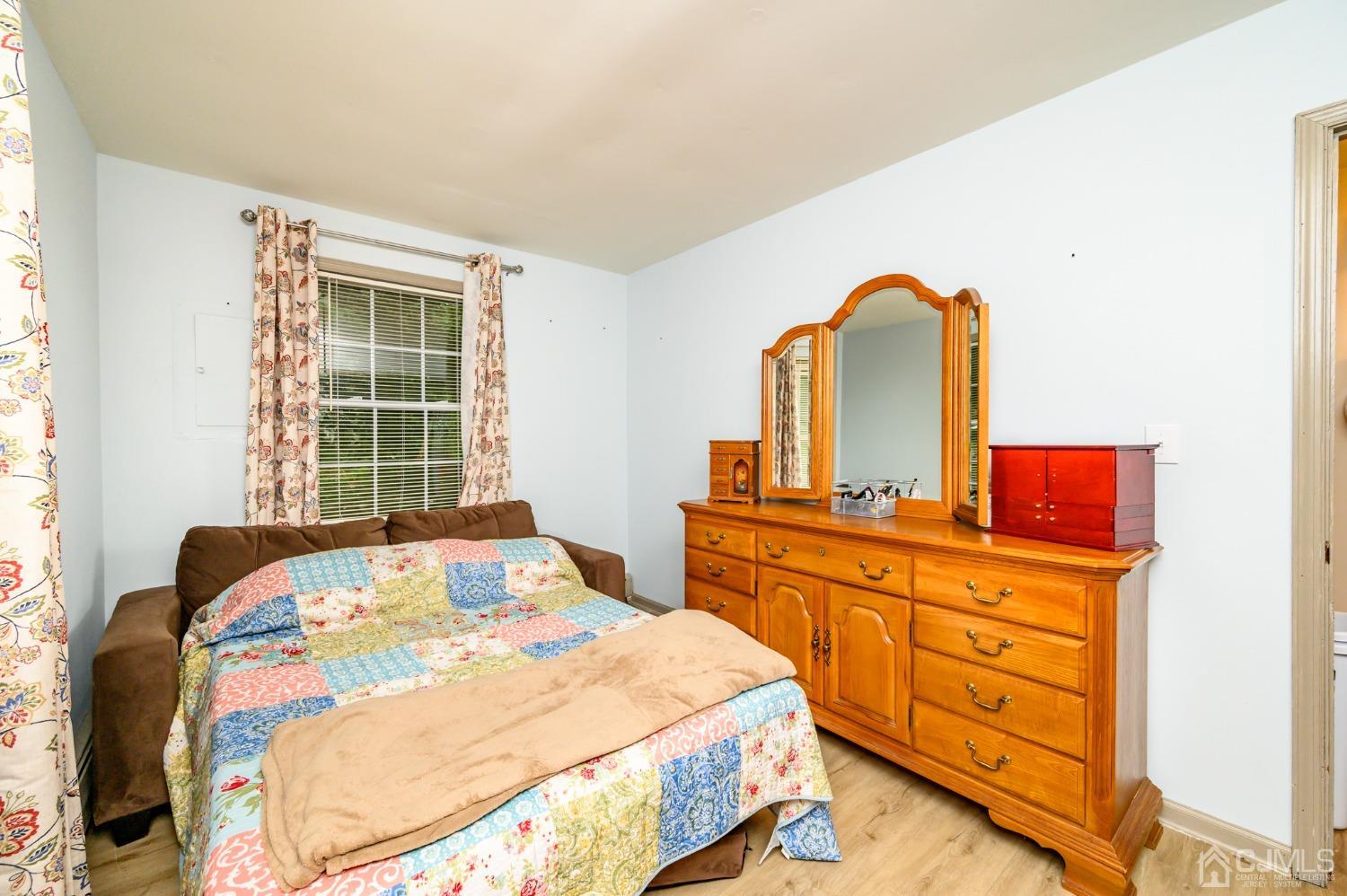 67 Hollow Road Glen Gardner, NJ 08826 - Photo 25 of 45 a bedroom with a bed and a dresser