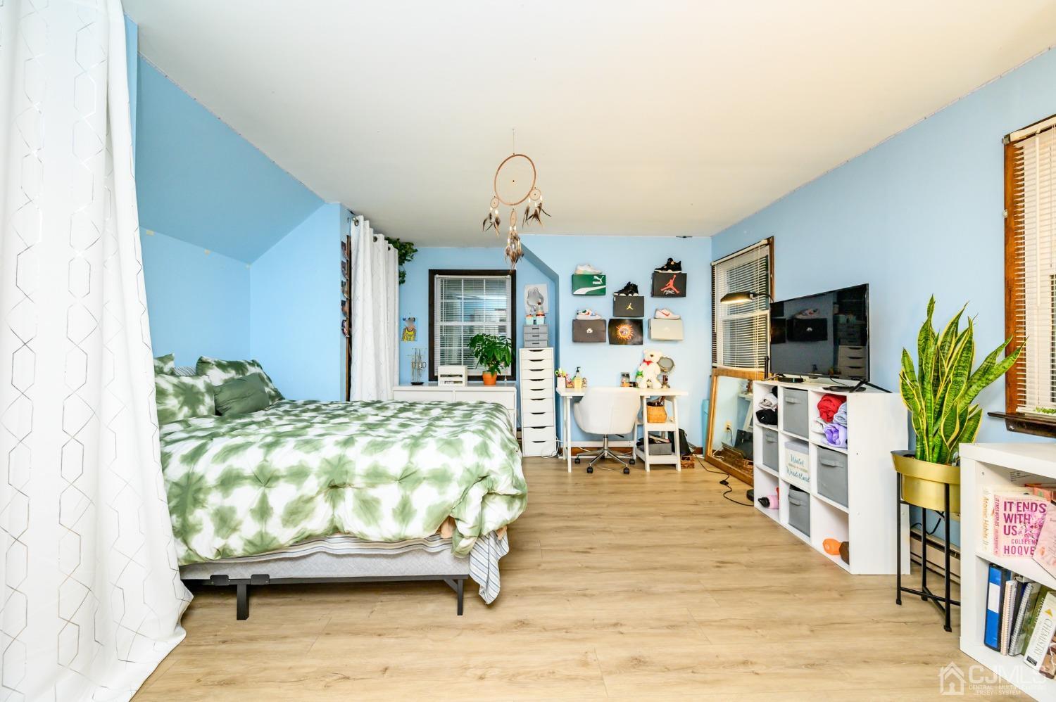 67 Hollow Road Glen Gardner, NJ 08826 - Photo 28 of 45 a living room with furniture and a flat screen tv