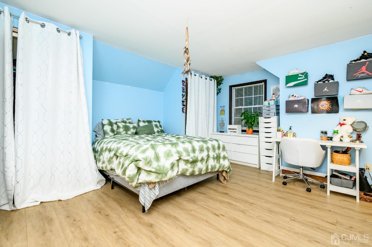 67 Hollow Road Glen Gardner, NJ 08826 - Photo 29 of 45 a bedroom with a bed window and table chair