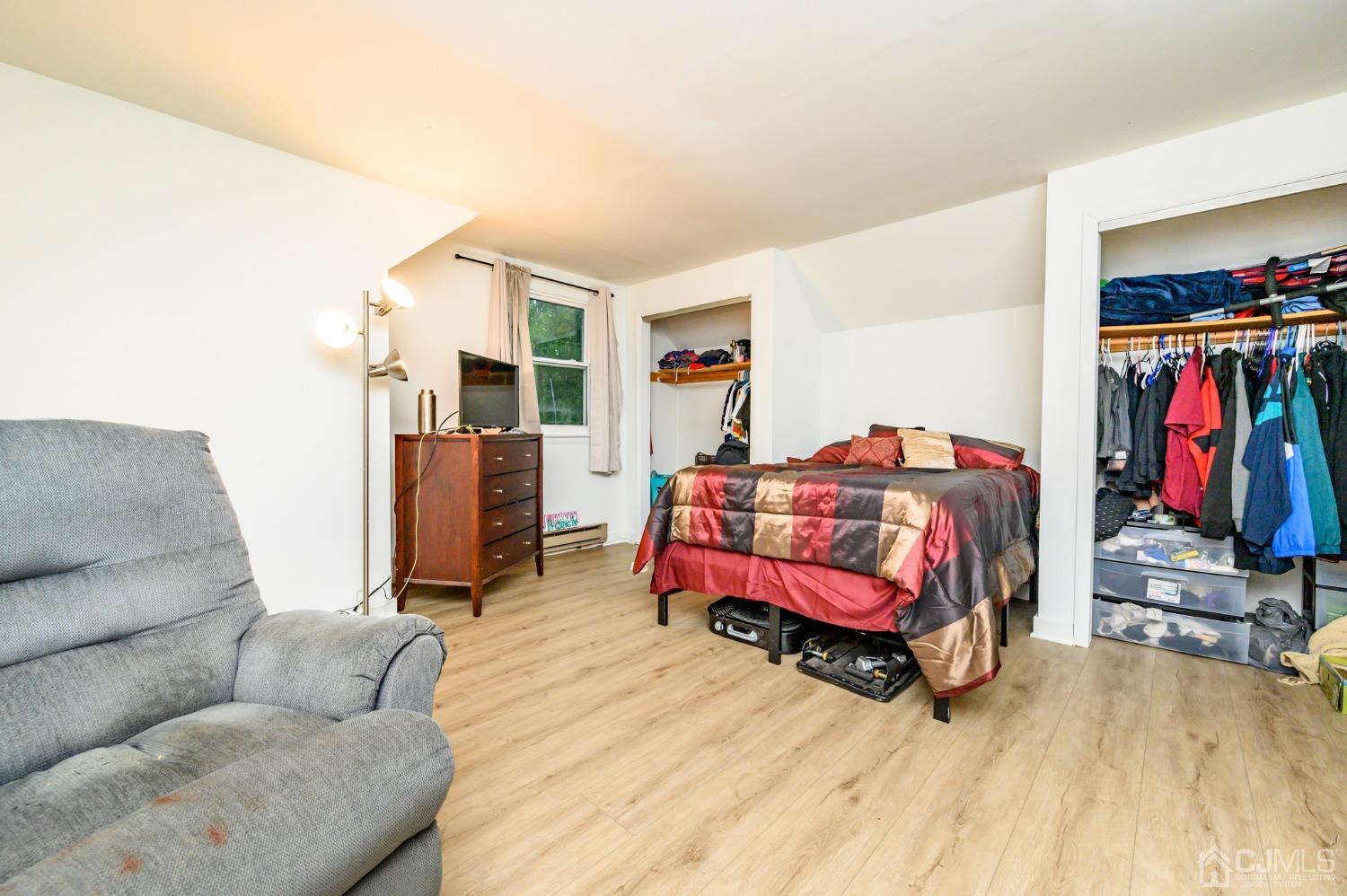 67 Hollow Road Glen Gardner, NJ 08826 - Photo 34 of 45 a bedroom with furniture and a wooden floor