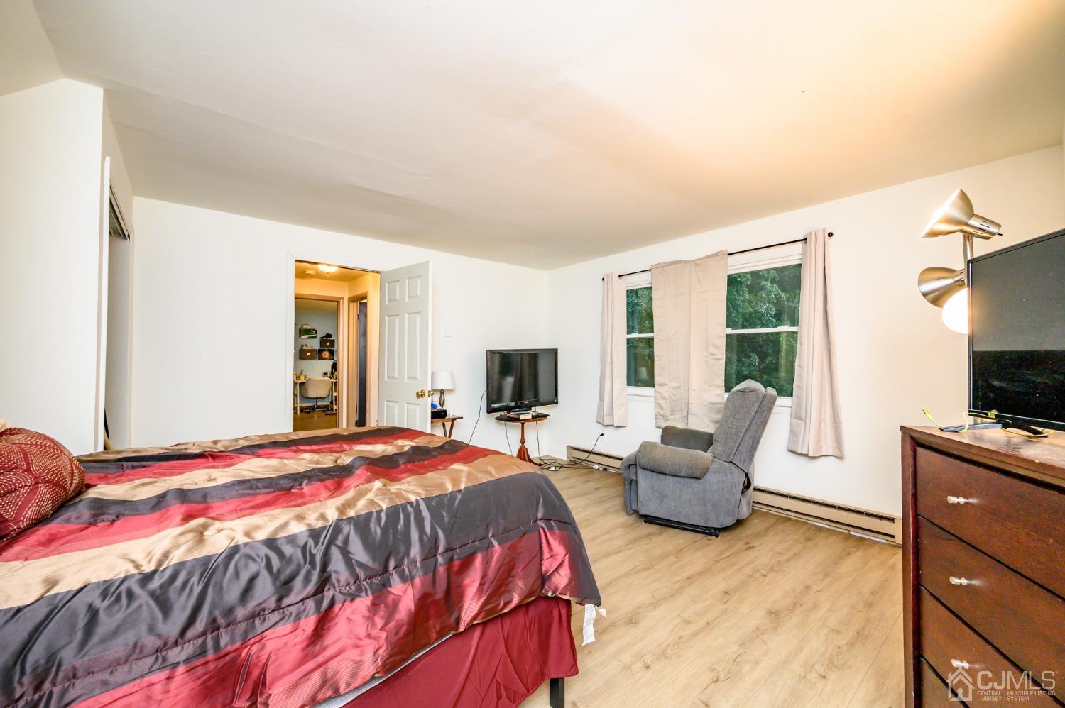 67 Hollow Road Glen Gardner, NJ 08826 - Photo 35 of 45 a bedroom with a bed and glass window