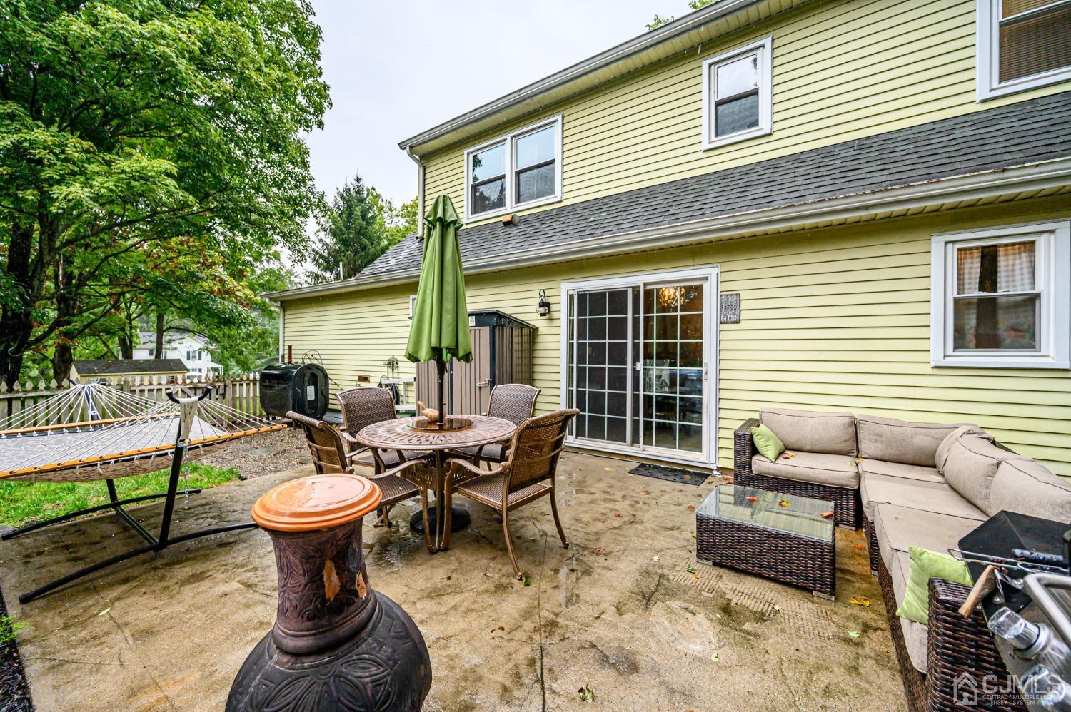 67 Hollow Road Glen Gardner, NJ 08826 - Photo 38 of 45 a view of a patio with couches chairs and wooden floor