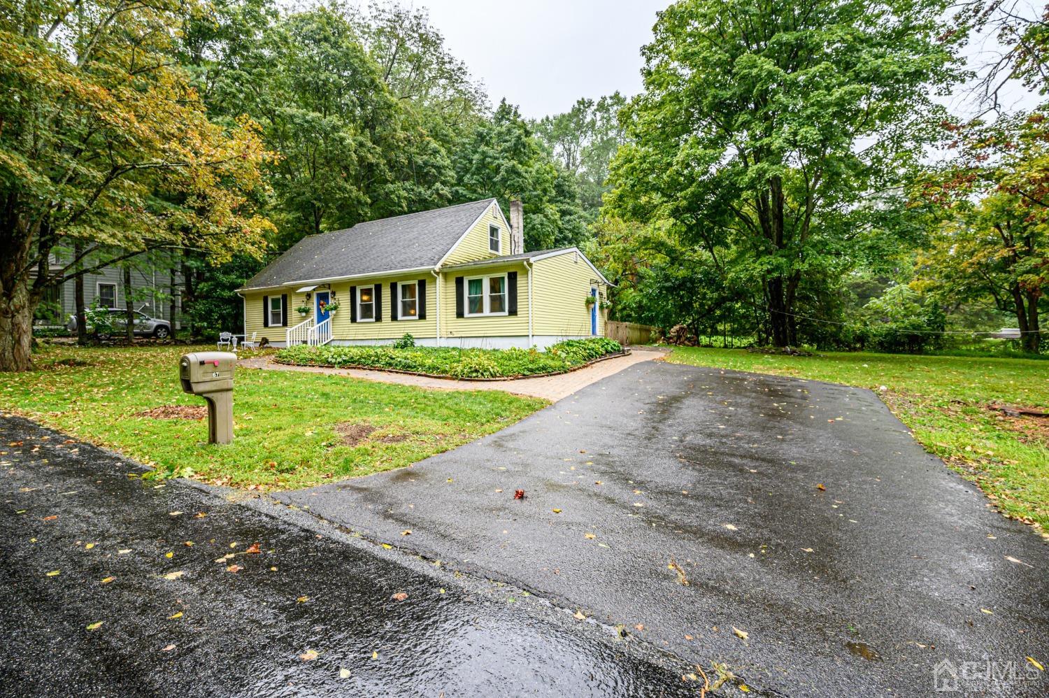67 Hollow Road Glen Gardner, NJ 08826 - Photo 45 of 45 a front view of a house with a yard and trees