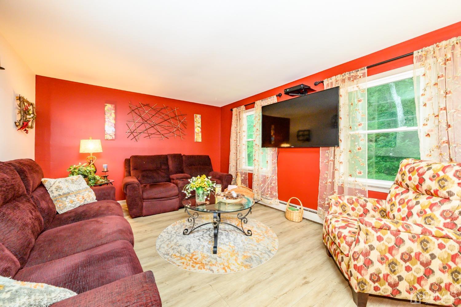 67 Hollow Road Glen Gardner, NJ 08826 - Photo 5 of 45 a living room with furniture and a large window