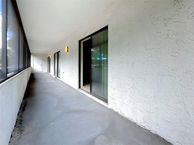 an aerial view of multiple houses with a yard