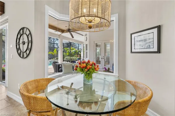 a living room with furniture and view of kitchen