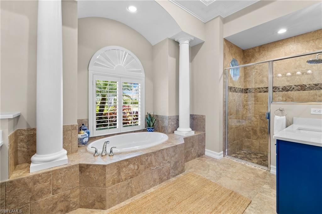347 Saddlebrook Lane Naples, FL 34110 - Photo 18 of 44 a bathroom with a tub a sink and a shower