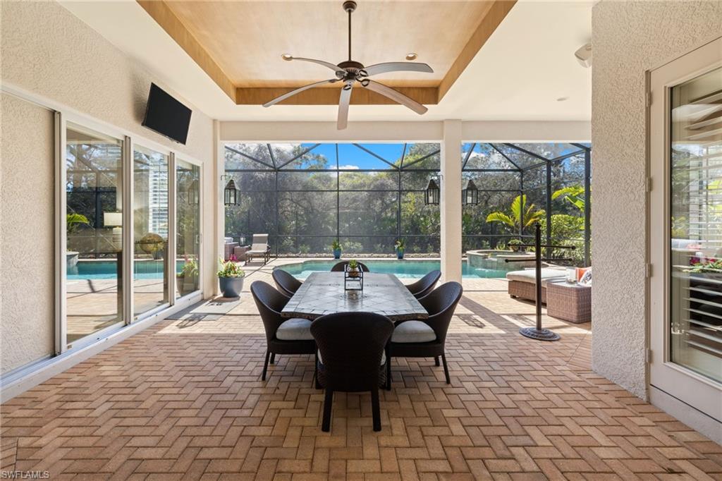 347 Saddlebrook Lane Naples, FL 34110 - Photo 20 of 44 a dining room with furniture and large windows