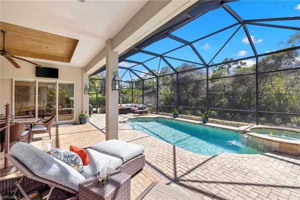 a outdoor space with patio couch and a potted plant
