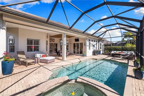 a view of a backyard with sitting area