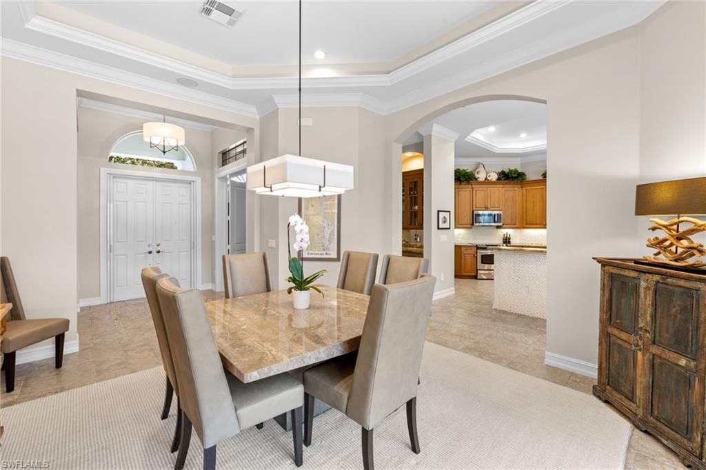 347 Saddlebrook Lane Naples, FL 34110 - Photo 5 of 44 a view of a dining room with furniture