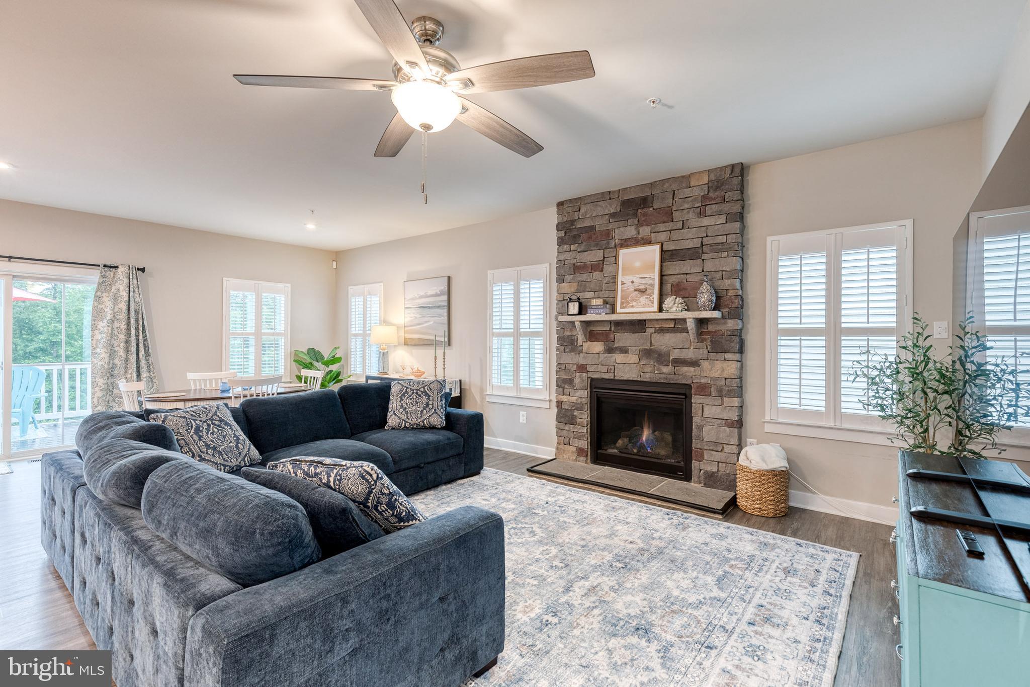 6003 Valentine Way Hanover, MD 21076 - Photo 6 of 52 a living room with furniture a window and a fireplace