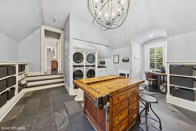 a room with pool table and windows