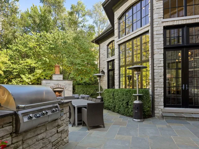 a view of a patio with table and chairs and potted plants
