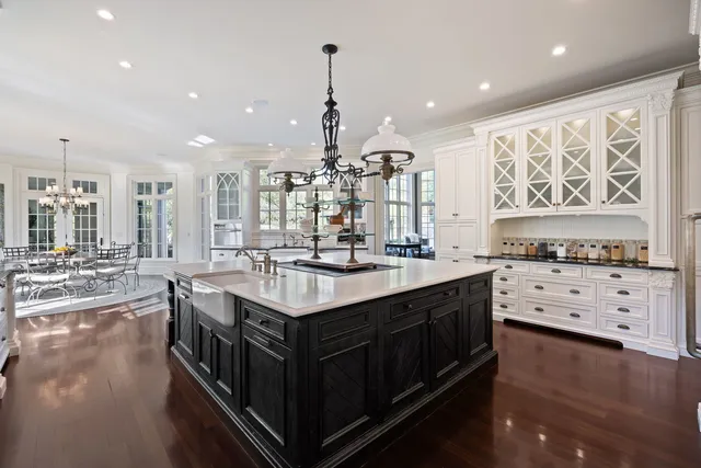 a kitchen with stainless steel appliances a sink stove and cabinets