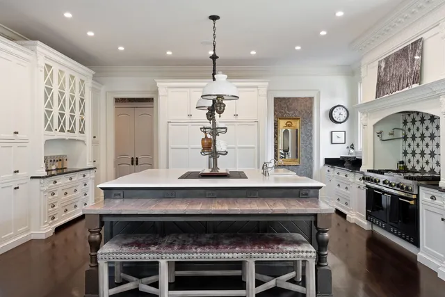 a kitchen with a stove and a kitchen island