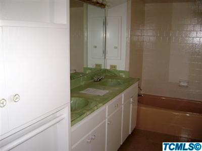 2193 West Visalia Road Exeter, CA 93221 - Photo 19 of 23 a bathroom with a granite countertop sink and vanity