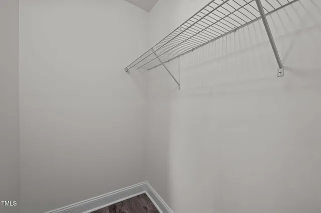 a bathroom with a sink vanity mirror and toilet