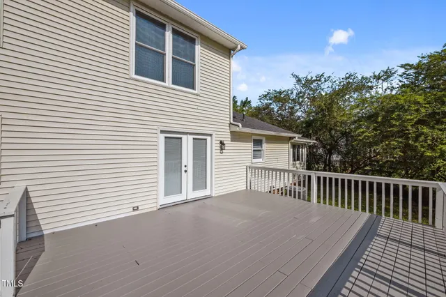 a backyard of a house with plants and trees