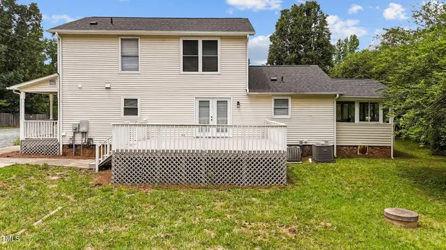 a backyard of a house with outdoor seating