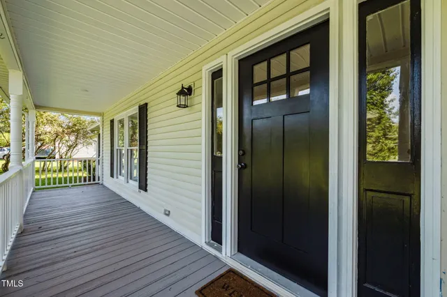 a view of hallway with wooden floor