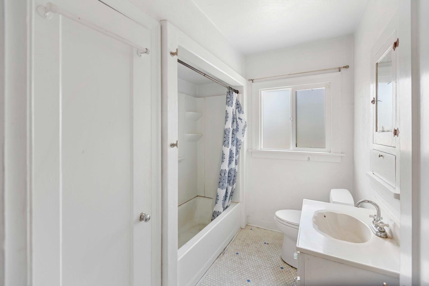 16735 Shannon Road Los Gatos, CA 95032 - Photo 11 of 19 a bathroom with a tub a sink and a shower