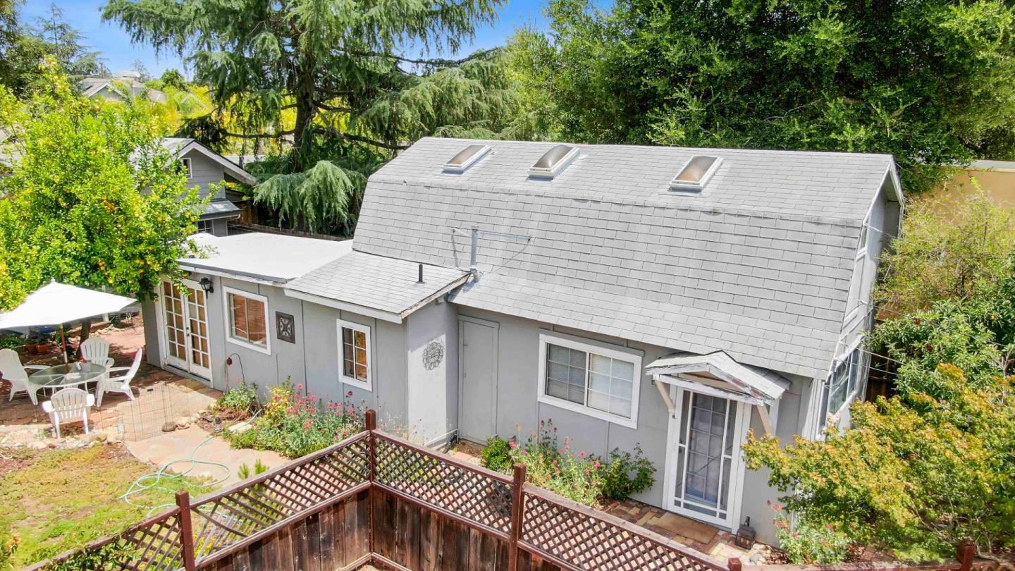 16735 Shannon Road Los Gatos, CA 95032 - Photo 16 of 19 a backyard of a house with seating space