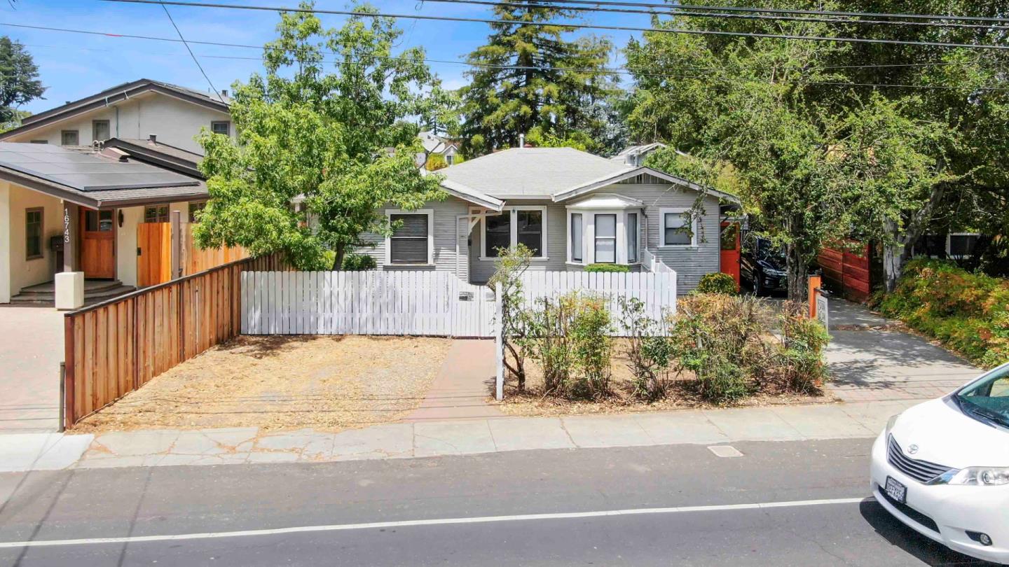 16735 Shannon Road Los Gatos, CA 95032 - Photo 2 of 19 a front view of a house with a yard and garage