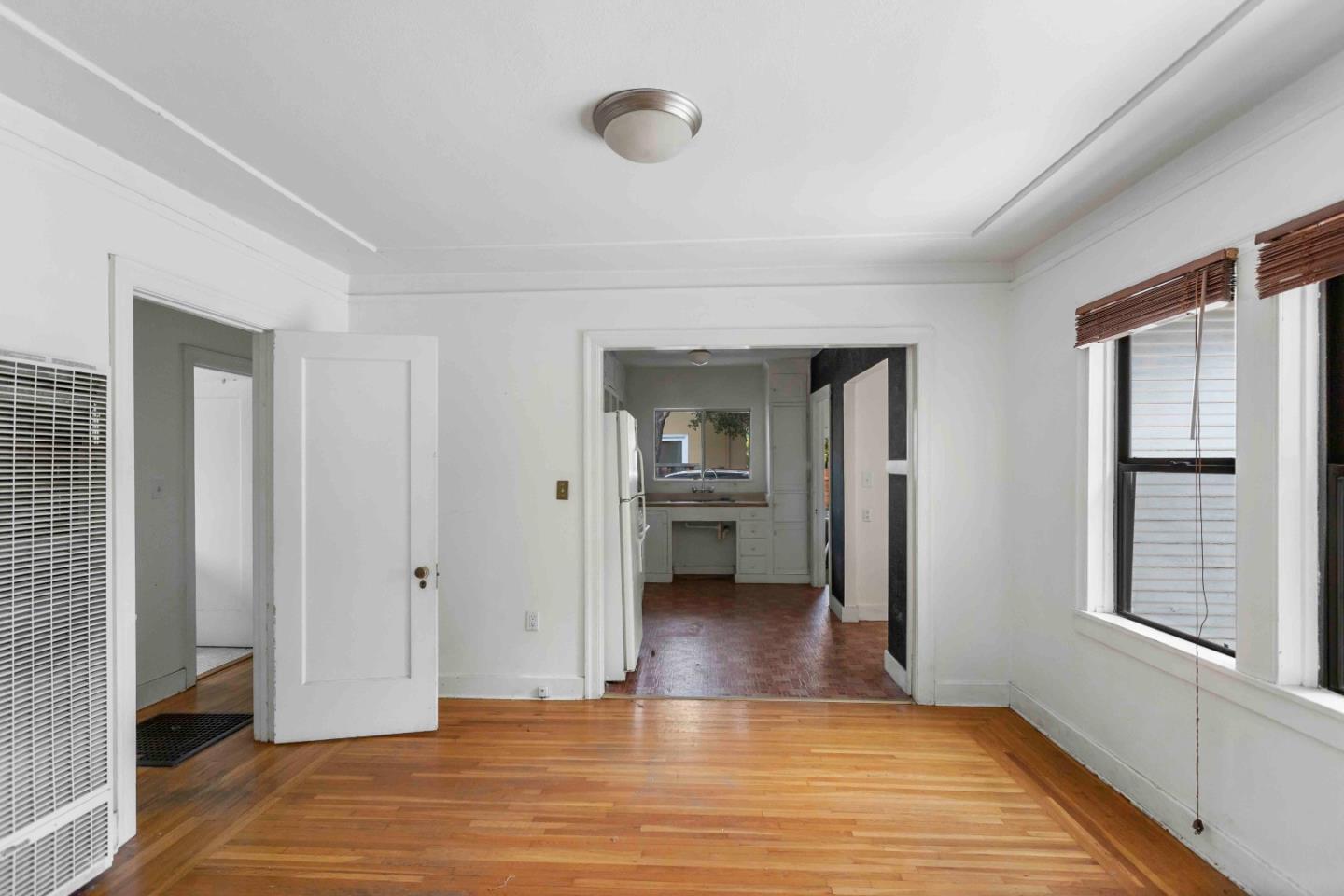 16735 Shannon Road Los Gatos, CA 95032 - Photo 5 of 19 a view of a room with wooden floor and a window