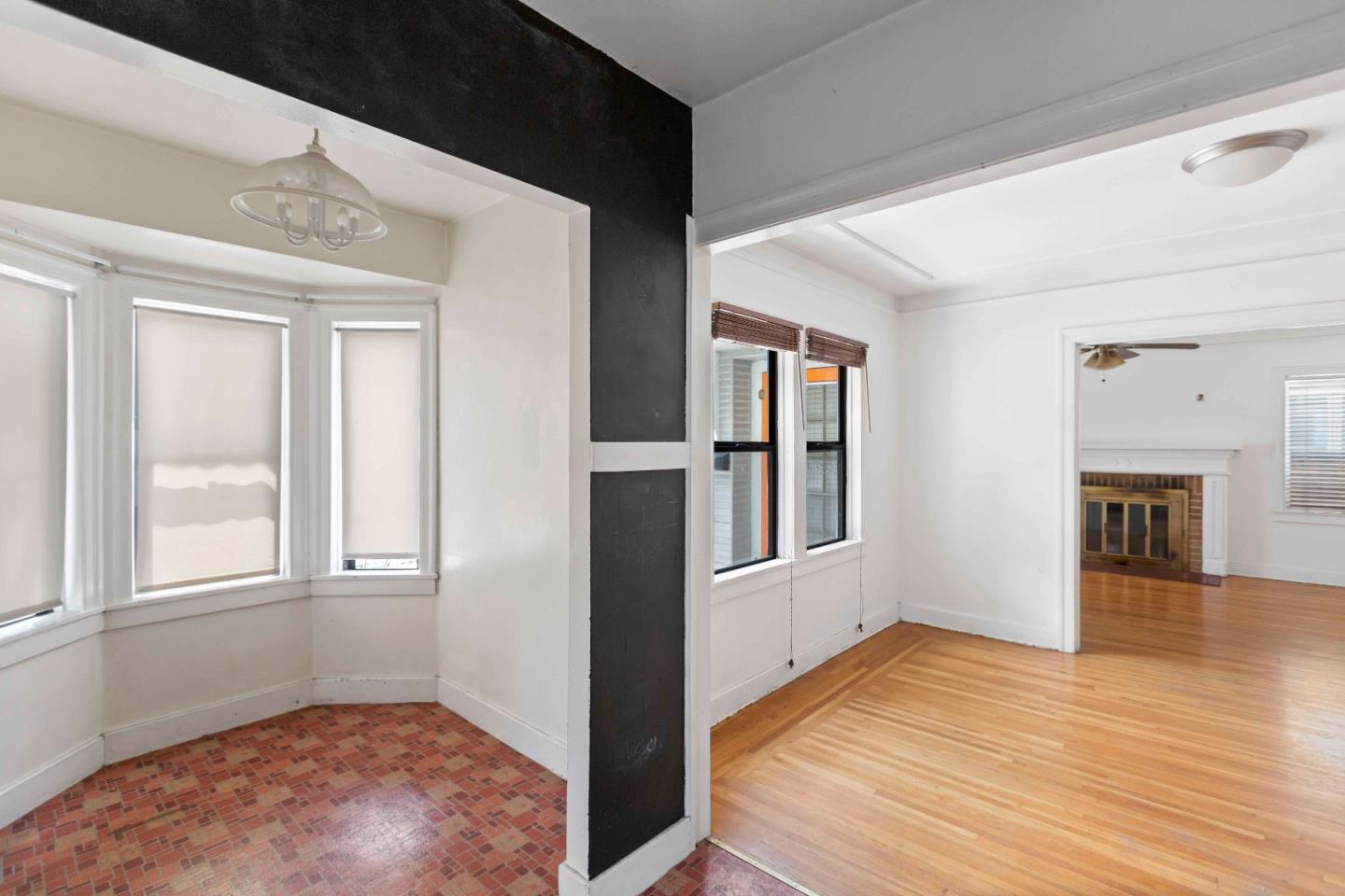 16735 Shannon Road Los Gatos, CA 95032 - Photo 8 of 19 wooden floor in an empty room with a window