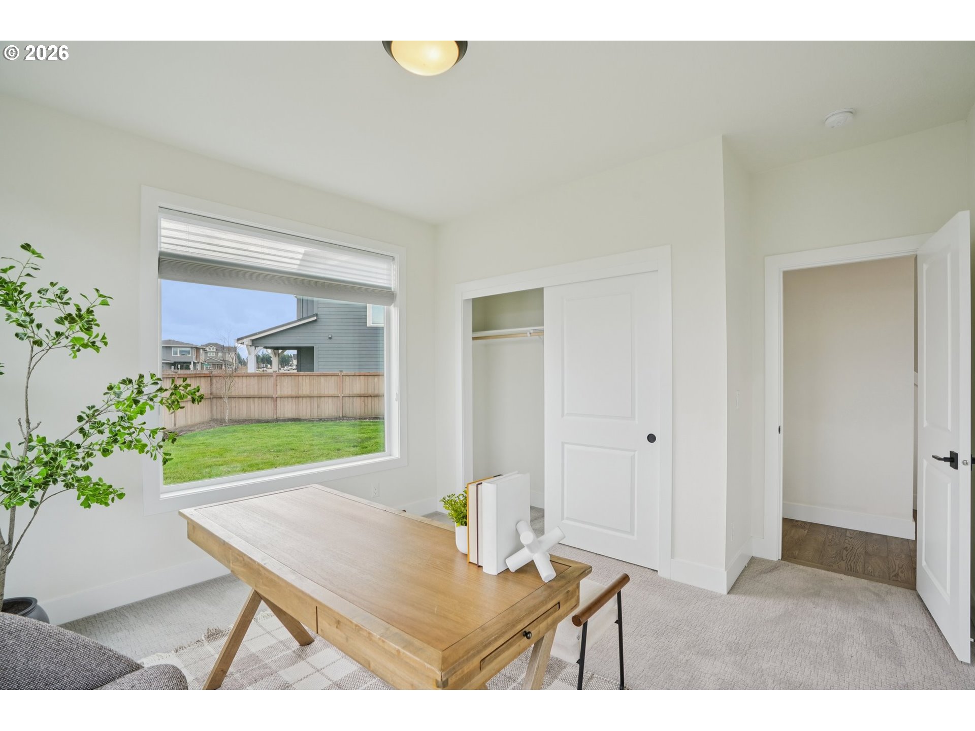 3809 Southeast Reed Drive Hillsboro, OR 97123 - Photo 17 of 40 a view of a room that has a table and chairs in it