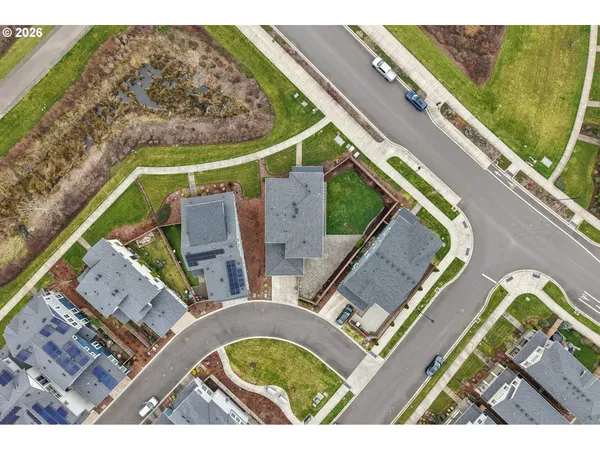 an aerial view of a house with a garden