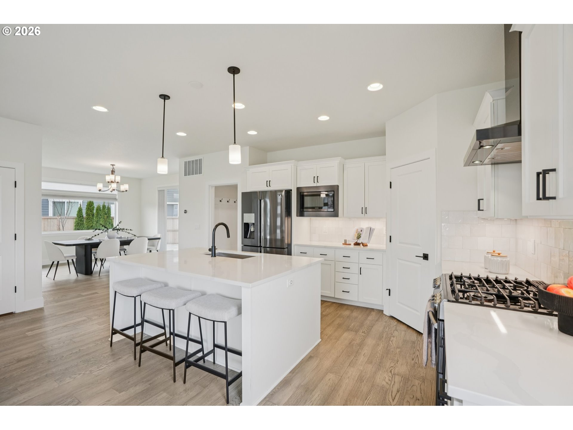 3809 Southeast Reed Drive Hillsboro, OR 97123 - Photo 9 of 40 a large kitchen with a table and chairs