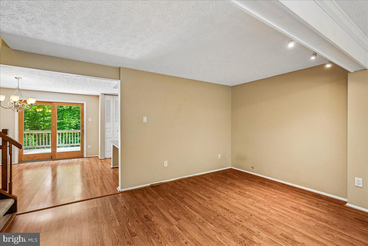 2331 Middle Creek Lane Reston, VA 20191 - Photo 15 of 78 an empty room with wooden floor and windows