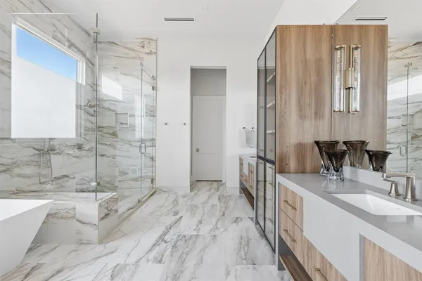 a bathroom with a bathtub and shower
