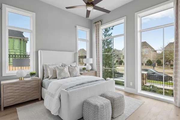 a bed sitting in a bedroom next to a window