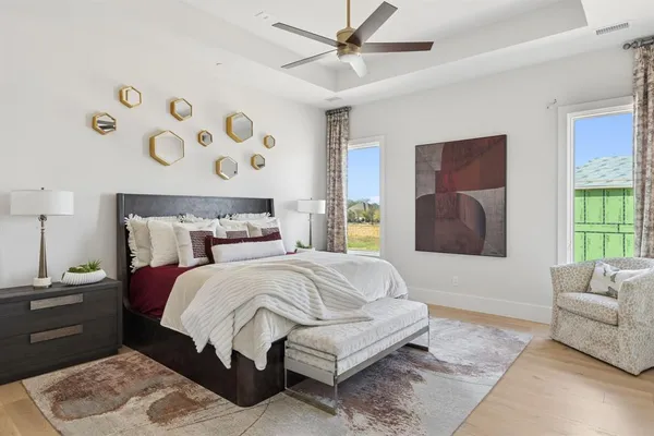 a bedroom with a bed and window