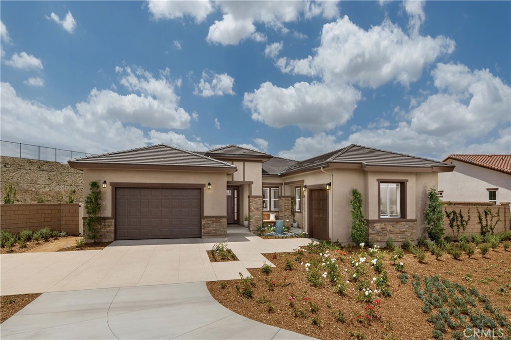 7581 Capstone Court Riverside, CA 92506 - Photo 1 of 1 a front view of a house with a yard and garage
