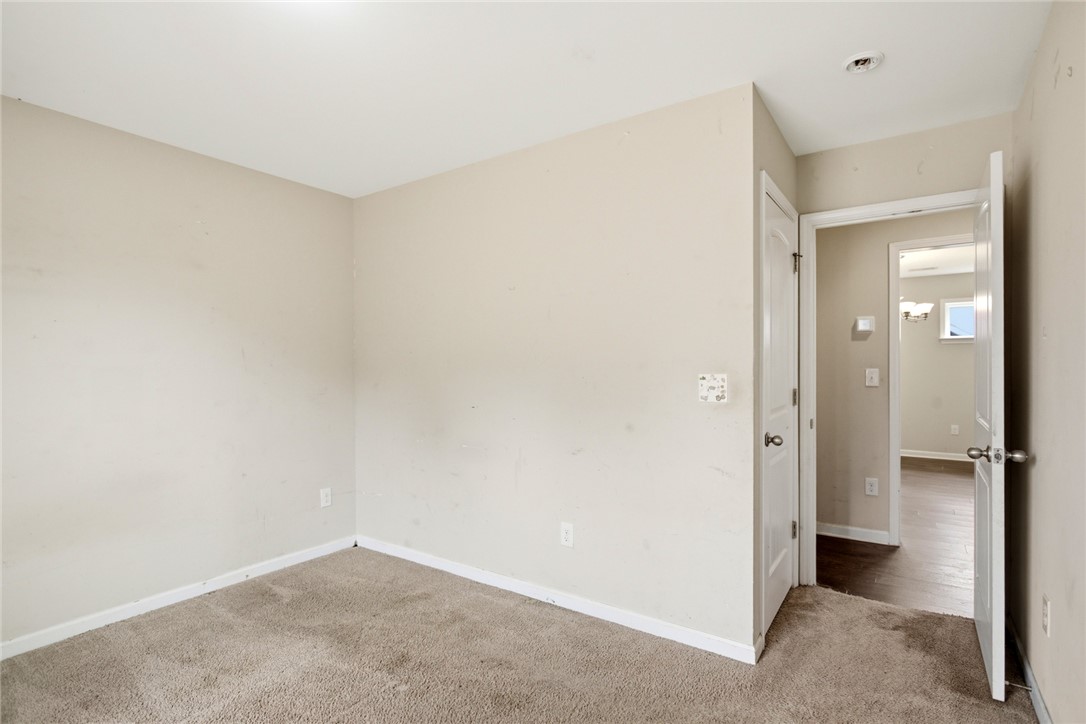 245 Maple Grove Road Seneca, SC 29678 - Photo 26 of 40 This spacious room offers comfort and versatility with plush carpeting and natural light.