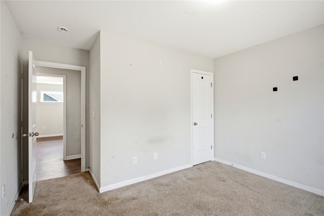 245 Maple Grove Road Seneca, SC 29678 - Photo 28 of 40 This spacious bedroom offers ample natural light and a neutral palette, ready for your personal touch.