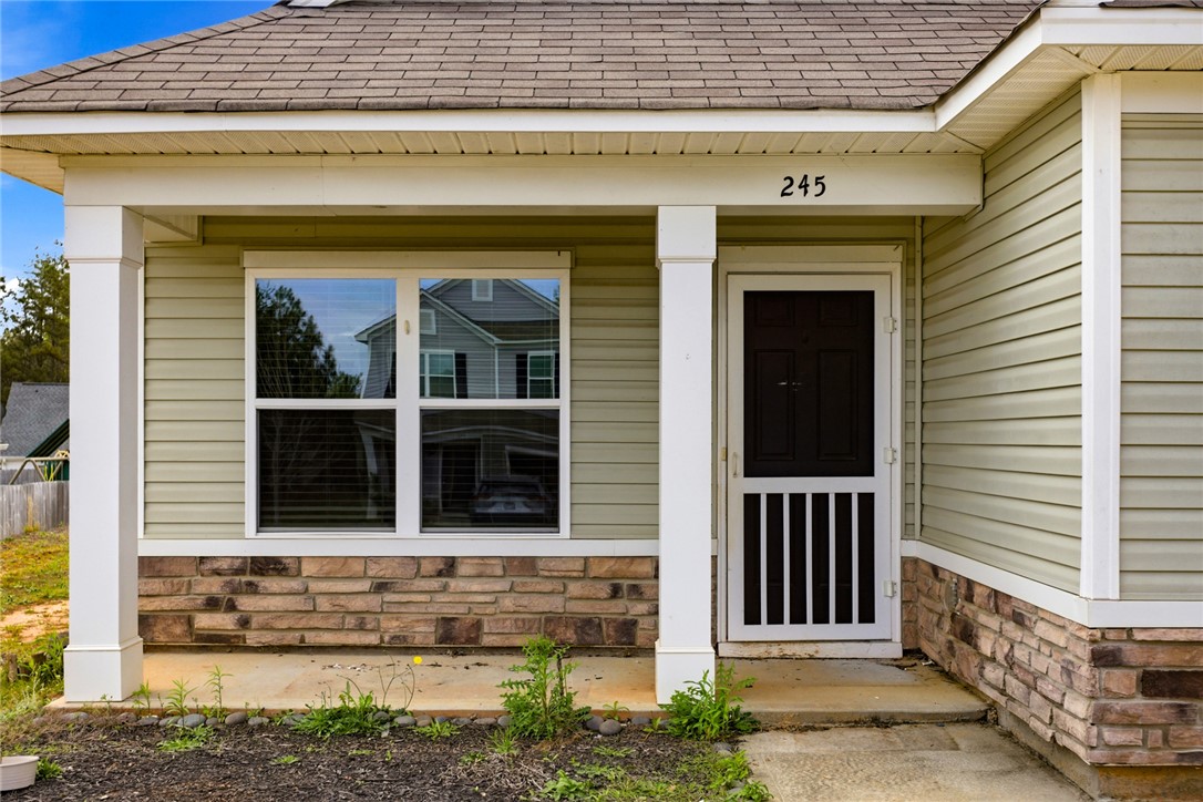 245 Maple Grove Road Seneca, SC 29678 - Photo 3 of 40 This charming home showcases a welcoming front entrance with durable siding and a sturdy roof.